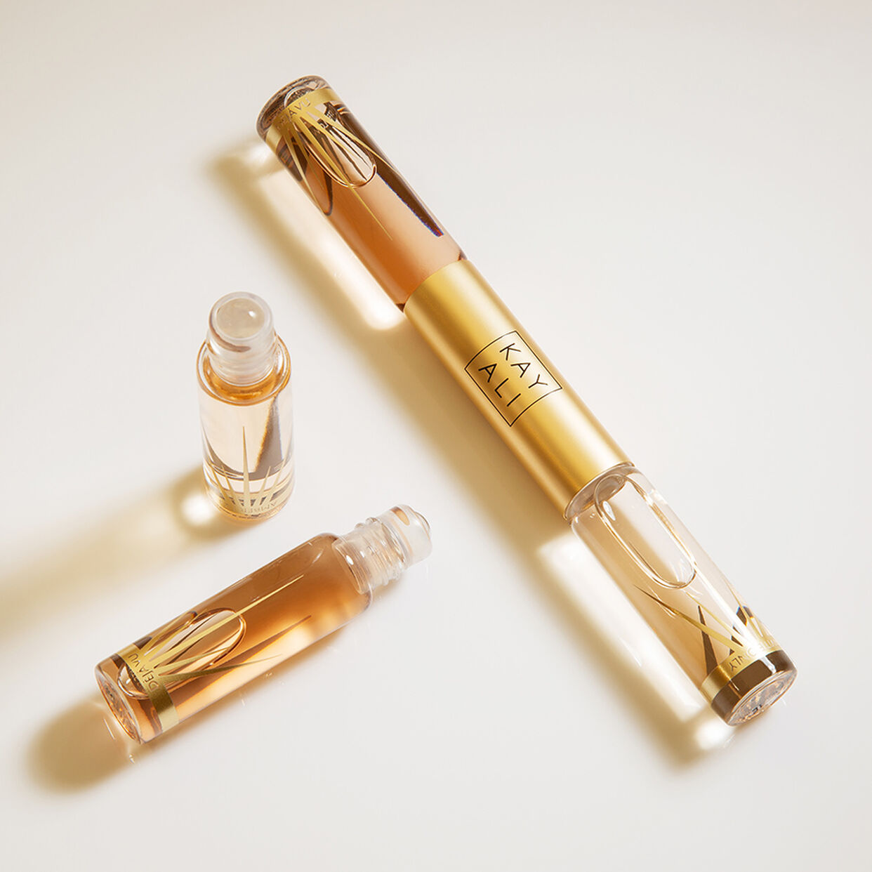 Miniature Déjà Vu White Flower | 57 & Invite Only Amber | 23 EDP Intense Rollerball