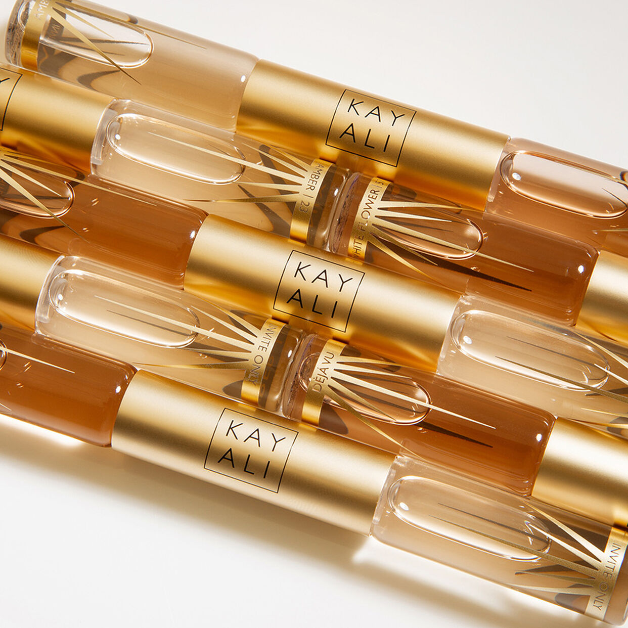 Miniature Déjà Vu White Flower | 57 & Invite Only Amber | 23 EDP Intense Rollerball