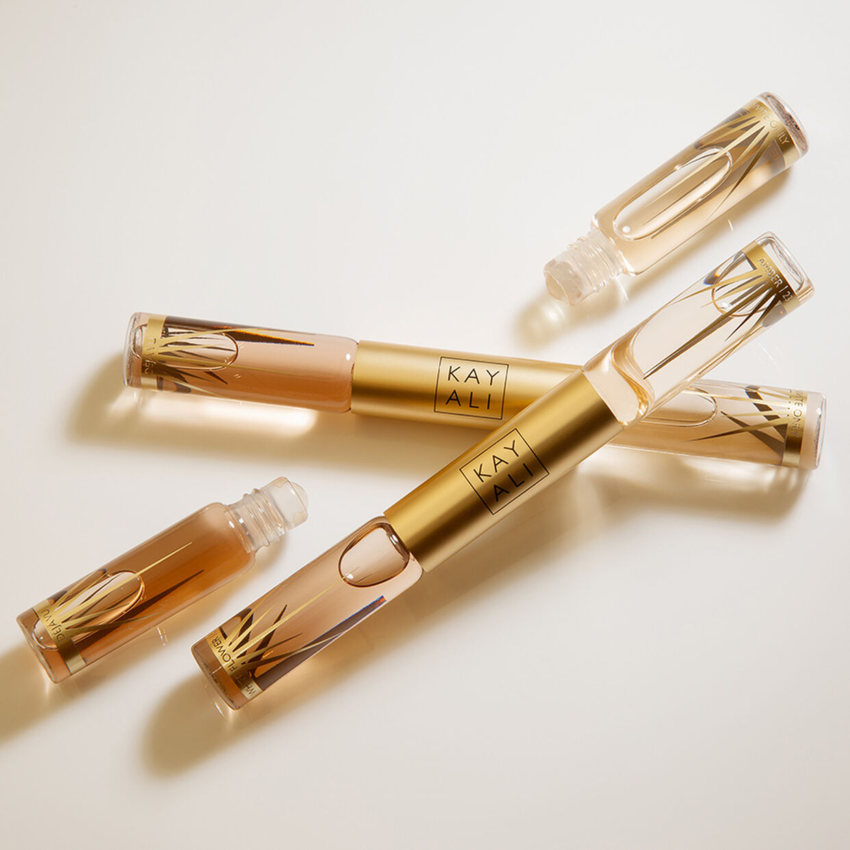 Miniature Déjà Vu White Flower | 57 & Invite Only Amber | 23 EDP Intense Rollerball