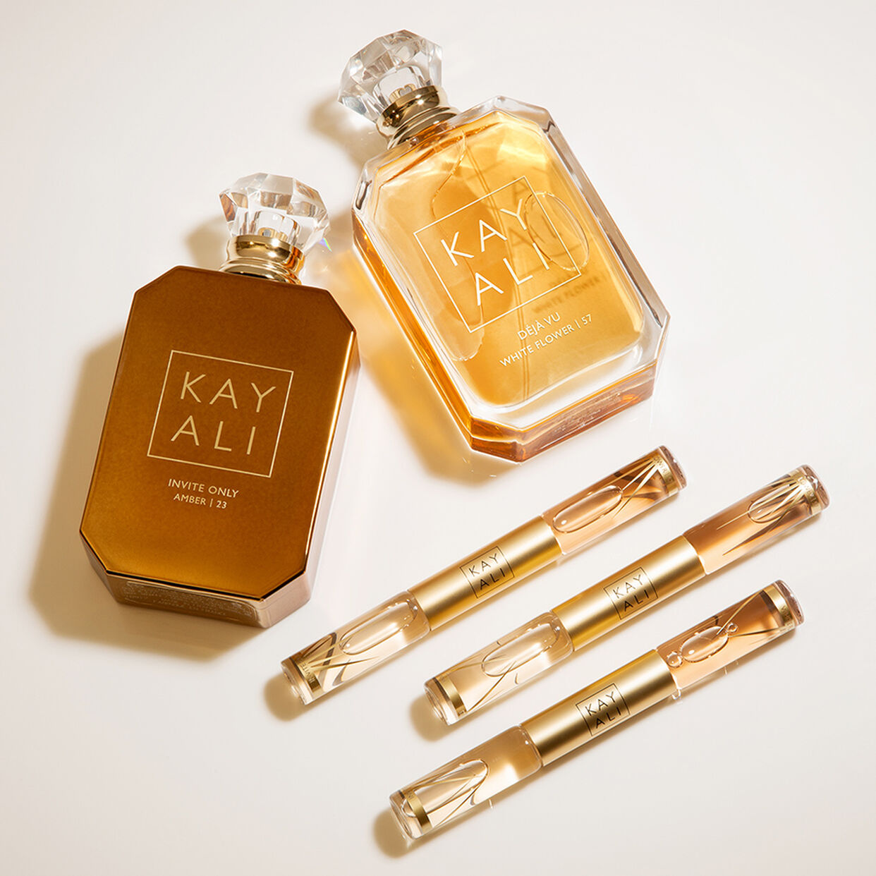 Miniature Déjà Vu White Flower | 57 & Invite Only Amber | 23 EDP Intense Rollerball